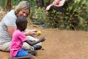 Dr. Jessica Tsotsoros playing with a child